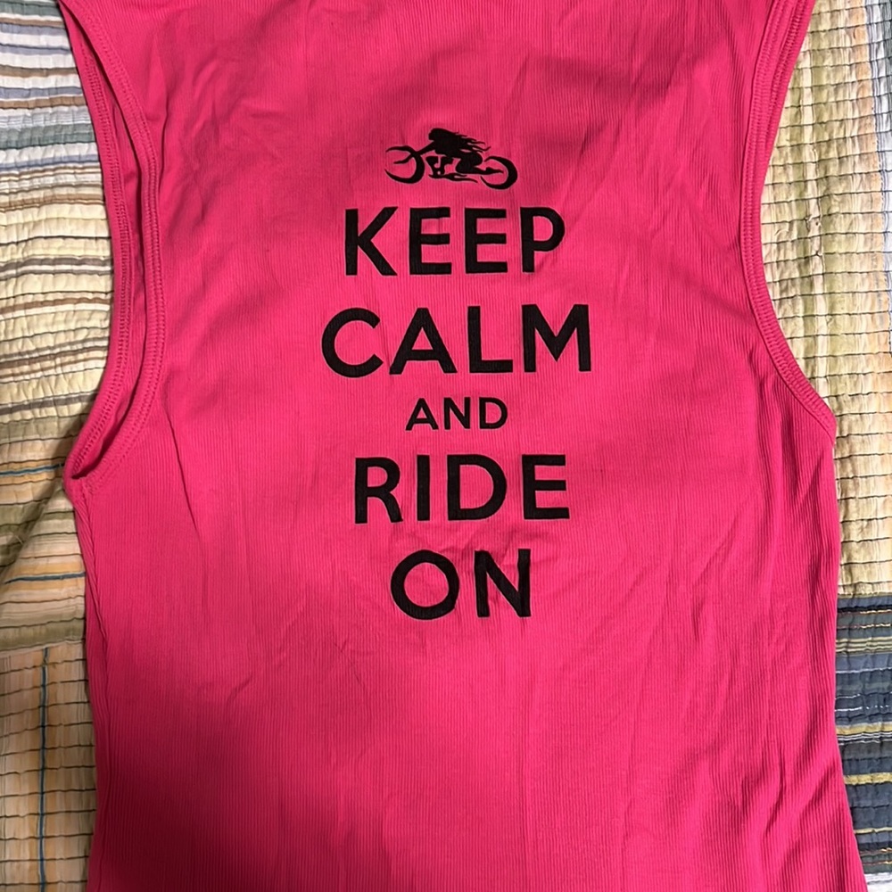 New without tags, pink tank top the writing is on the back of the tank.